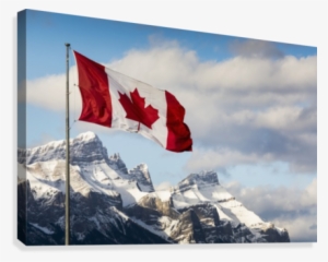 Canadian Flag Blowing In The Wind On A Flag Pole With #1350357