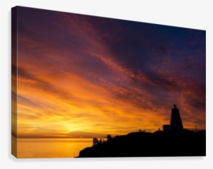 Silhouette Of A Lighthouse On A Cliff Overlooking A #1766114