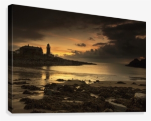 Silhouette Of A Lighthouse Along The Coast At Sunset #1766213