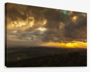 Golden Sunset With Glowing Clouds And Silhouetted Landscape #4098440