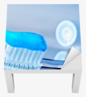 Toothbrush And Toothpaste Tube On The Table Lack Table - Toothpaste Invented #4185789