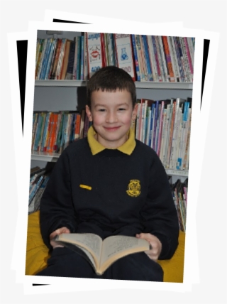 A Delapre Child Sitting Smiling With A Book - Sitting #6193165