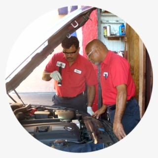 Two Men Checking Some Parts Of An Auto #7010602
