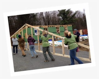 Volunteers Carry Trusses On A Green Mountain Habitat #8305625
